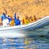 A rigid inflatable boat filled with passengers cruising the waters of Cabo San Lucas